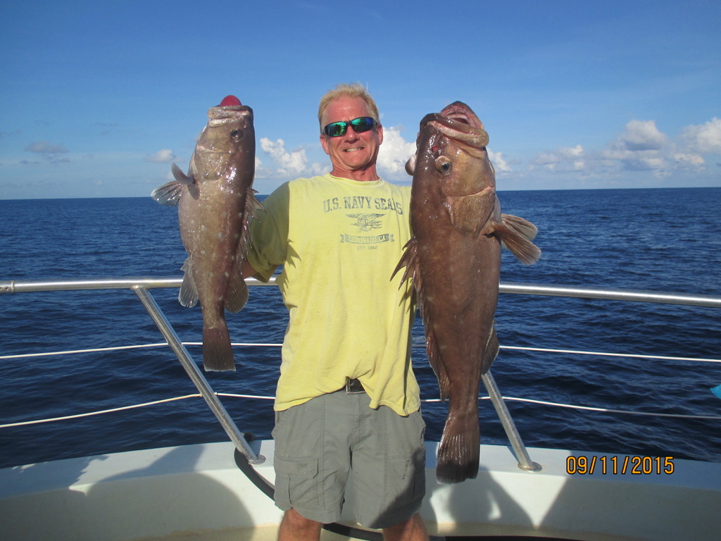 F3DCB933-0BD5-42B3-90F2-5B248D1974A9_1_105_c a man holding a fish in the water