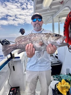 a person holding a fish