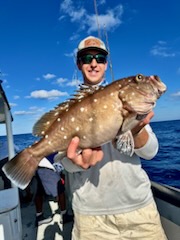 a person holding a fish