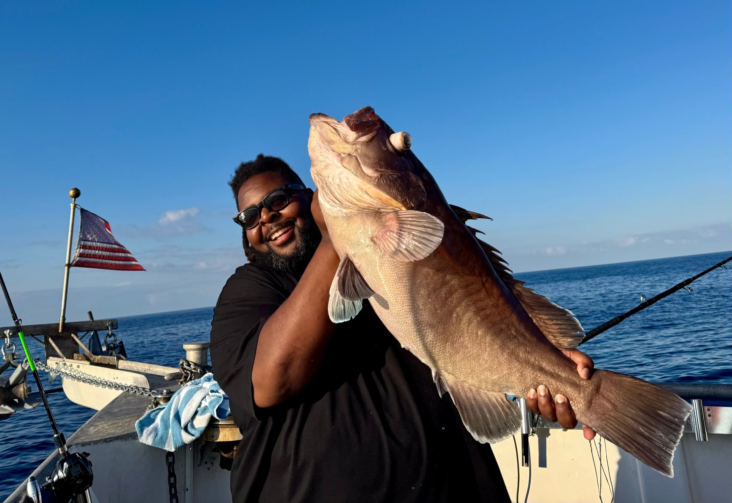a person holding a fish in the water